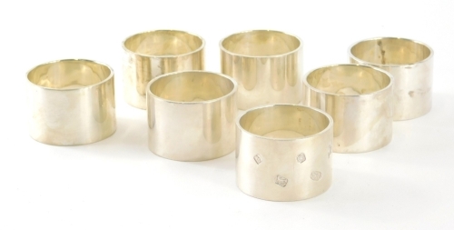 A set of seven Elizabeth II silver napkin rings, by Dawson of Stamford, of plain circular form, Sheffield 2005, 17.8oz.