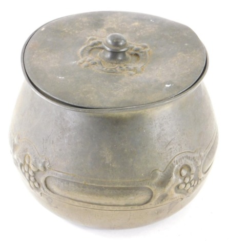 A late 19thC Tudric pewter lidded bowl, of bellied circular form raised with berries with removable lid impressed marks beneath, 14cm high.