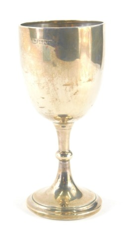 A George V silver goblet, the plain bowl on inverted stem and circular foot initialled AWM 1921, London 1911, 8cm high, 3oz.