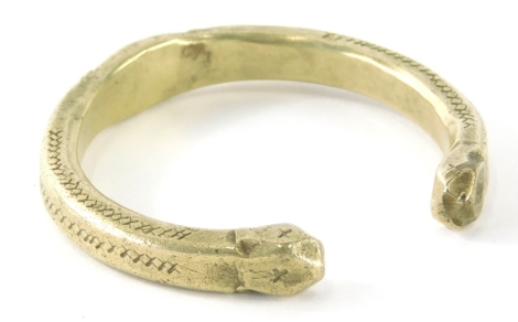 A cast copper alloy torque bangle, partially textured with shaped ends, of C shaped form, found in wall Skillywadden August 1997, with associated paperwork.