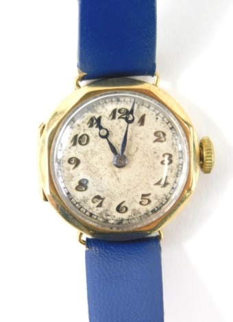 A 9ct gold cased ladies wristwatch, with Arabic dial, pierced hour hand, octagonal head and 2cm diameter face, with blue leather strap.