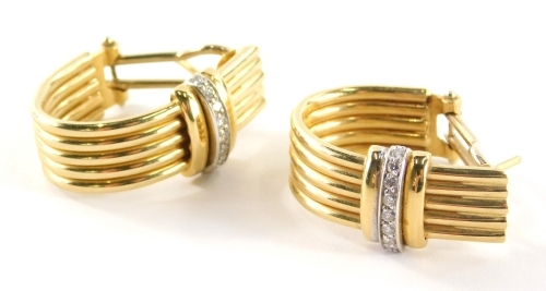 A pair of 18ct gold hoop earrings, each hoop formed of five bars, with a diamond set clip, matching the previous lot, yellow metal stamped 18k, approximately 0.50ct overall, 13.6g all in.