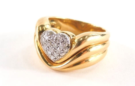 A diamond pavè set dress ring, with central heart emblem with pavè set round brilliant cut diamonds, one missing, on a three scroll triple reeded band, approx 0.25cts, yellow metal stamped 18k Italy, ring size O½, 11.1g all in.