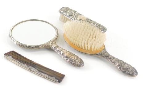 Elizabeth II silver four piece dressing table set, comprising hand mirror 23cm high, hair brush and clothes brush with similar comb, Birmingham 1978. (4)