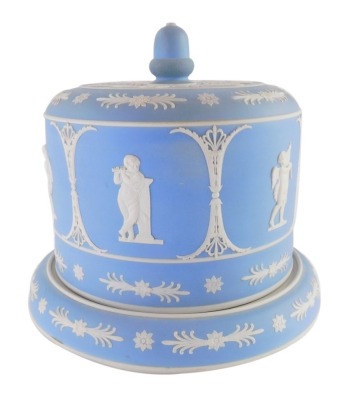 A Wedgwood pale blue Jasperware cheese dome and cover, decorated with neoclassical figures, scrolls, flowers, etc., and with an acorn knop, impressed mark to underside, 25cm high.