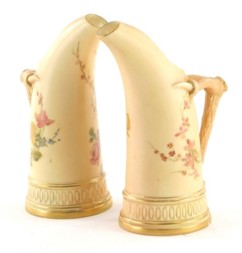 A pair of Royal Worcester porcelain tusk vases, circa 1893, each with gilt highlighted bark work handles, hand painted with flowers, similar marks beneath, 16cm high.