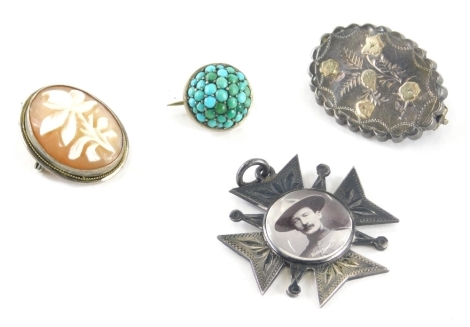 A group of silver jewellery, to include a silver and turquoise set brooch, silver shield fob with central Baden Powell picture, silver Victorian oval floral brooch and a cameo and silver framed brooch/pendant, 21.1g all in. (4)