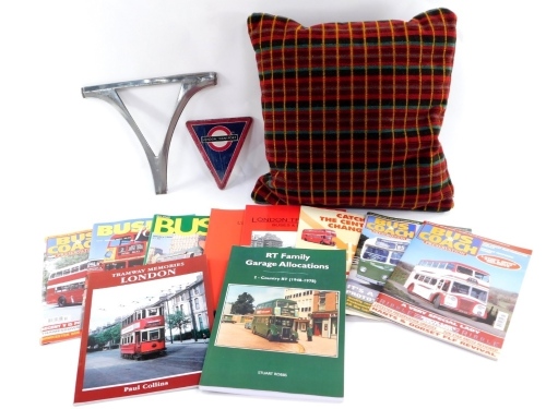 A group of London Transport wares, to include London Transport enamel badge, buses magazines, and a red chequered bus seat cushion. (1 box)