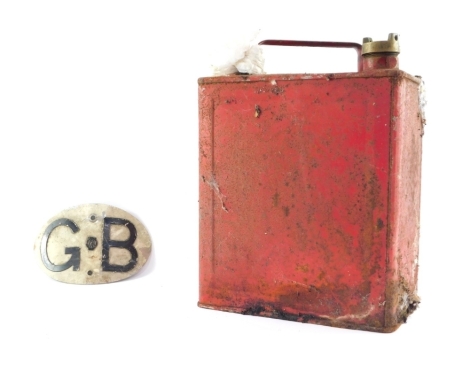 A vintage red petrol can, and a GB car sign. (2)