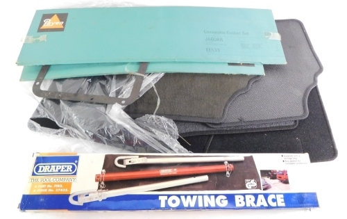 A group of car accessories, to include a set of Mazda floor mats, a Jaguar conversion gasket and head gasket set, and a Draper towing brace. (a quantity)