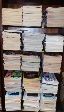 A large group of Auto Sport magazines. (6 shelves)