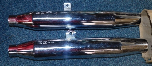 A pair of Harley Davidson tail pipes.