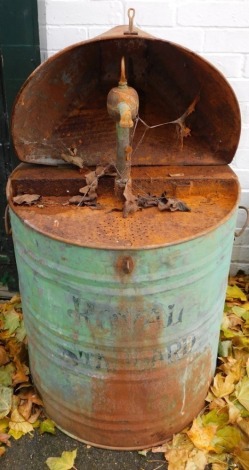 A Royal Standard green oil drum dispenser.