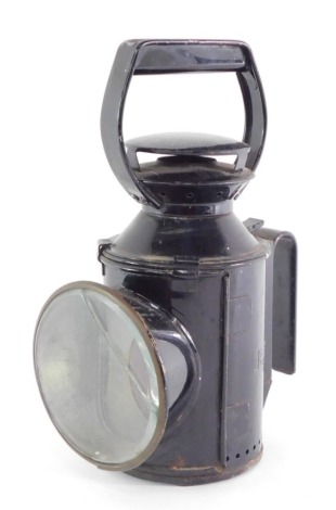 A black metal carriage lantern.