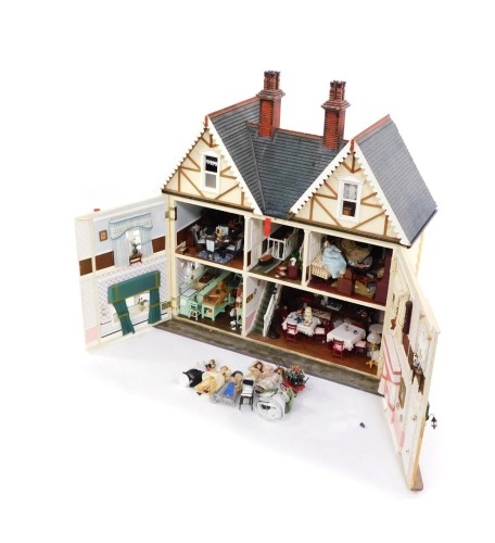 An doll's house with extensive contents, over three various floors with dining suite, bedrooms, and accessories, 102cm high, 110cm wide, 42cm deep.