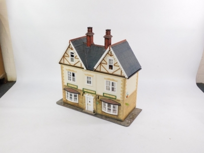 An doll's house with extensive contents, over three various floors with dining suite, bedrooms, and accessories, 102cm high, 110cm wide, 42cm deep. - 3