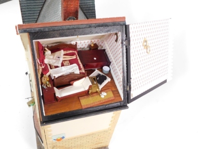 An doll's house with extensive contents, over three various floors with dining suite, bedrooms, and accessories, 102cm high, 110cm wide, 42cm deep. - 4
