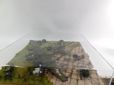 A diorama of a Boeing B17 Flying Fortress, 1:72 scale, crash landed with figures, in perspex case. - 2