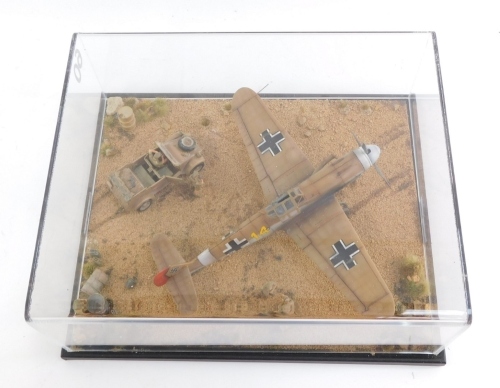 A diorama of a Messerschmitt, B1-1094H Trop3 Hans Joachin Marseille Africa September 1942, with figures, in perspex case.