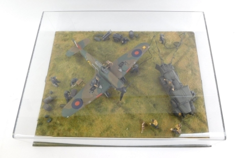 An diorama of a Mk1 Hawker Hurricane, 1:48 scale, Battle of Britain scene with figures, in a perspex case.