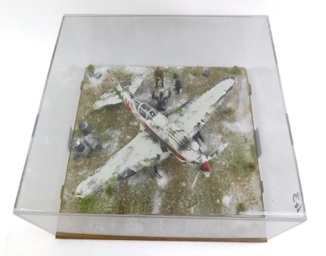 A diorama of a Soviet Mikoyan-Gurevick MiG3, scale 1:32, in a perspex case.