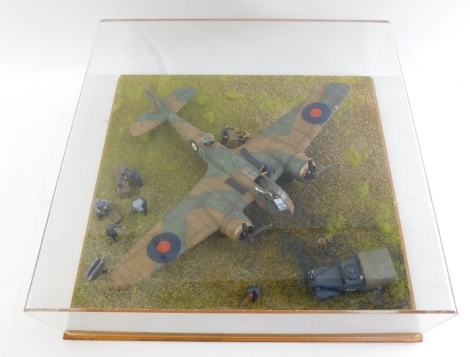 A diorama of an RAF Bristol Blenheim MK1, 1:72 scale, with figures and support vehicle, in perspex case.