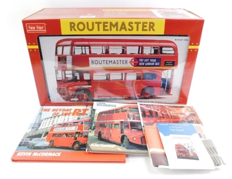 A Sun Star Route Master die cast model bus, scale 1:24, boxed, together with a London tea towel, Ian Allan Bus Profile Routemaster guide, and The Hay Day of the RT book. (4)