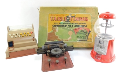 A Bengal 1950's table tennis vintage game, a child's typewriter, plastic Casden number 909142 till, and a bubble gum machine, (4)