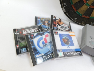 A Sony Playstation 1, with controller, and five games, Grand Tourismo II, Popelovs The Beginning, Tom Clancy's Rainbow Six, Knockout Kings 2000, Harry Potter and The Philosophers Stone, and memory card. - 2