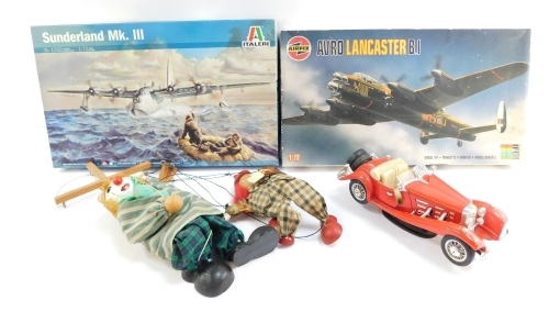 Two 1:76 scale kit builds, comprising an Airfix Avro Lancaster B1 and an Italeri Sunderland MK3, boxed, together with Burago car and two puppets. (5)