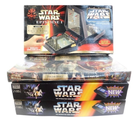 A group of Star Wars games, to include Star Wars Episode 1 Galactica Battle Strategy game, two Star Wars Interactive Video board game, Star Episode 1 Jar Jar Binks 3D Adventure game. (4)