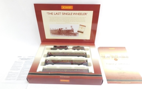 A Hornby The Last Single Wheeler scale model set, comprising LMS Single L-2-2 locomotive 14010, LMS composite coach 3546, LMS composite coach 3457 and LMS brake coach 6618, boxed.