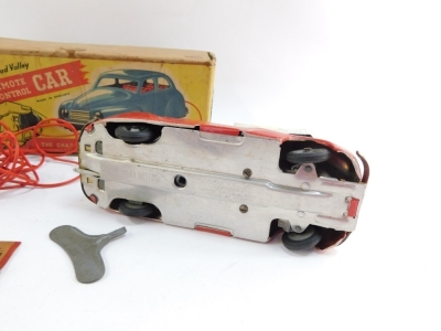 A Chad Valley clock work remote control car, boxed. - 2