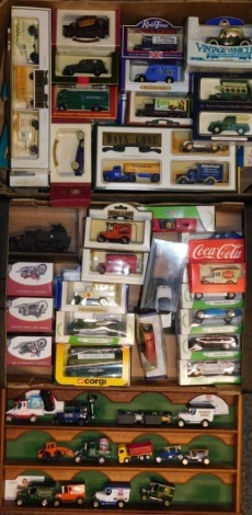 A group of die cast cars and vehicles, Coca Cola bus, Harley Davidson motorbikes, vintage classics, Mobil Days Gone and others, with one wall mountable display case. (2 boxes)