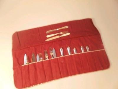 A set of six early 20thC dessert knives and forks with silver ferrules