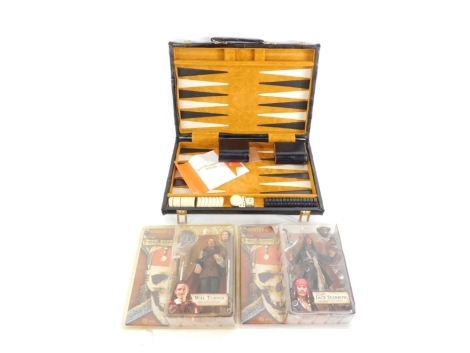 Two series one Pirates of The Caribbean collector's figures, Will Turner and Captain Jack Sparrow, together with a cased backgammon set.