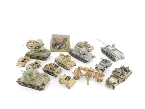 A group of kit built armored vehicles, tanks machine guns, figures, stage sets, etc. (1 box)