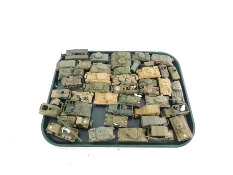 A group of kit built armored plastic tanks, loaders, guns, etc. (1 tray)