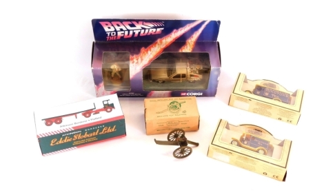 Various cased die cast vehicles, comprising a Corgi Back To The Future Delorean, an Eddie Stobart flatbed truck, a Royal Artillery Gun from Britain's Toy Soldiers, and two Rington's Teas Days Gone models. (5)