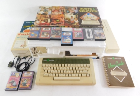 An Acorn Electron computer, joy stick controller, Creative Graphics cards, 10 game cassettes, expansion pack and manuals, etc. (a quantity)