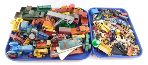 A group of die cast agricultural vehicles, Dinky Toys, BRM racing car, etc, play worn. (2 trays)