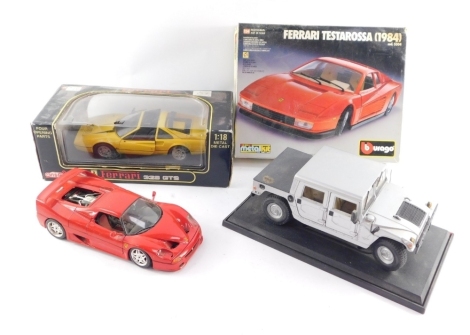 Burago and Maisto die cast motor cars, comprising a Burago Ferrari F50, Burago die cast metal kit with plastic parts Ferrari Testerossa 1984, No 5504, Burago Ferrari 1:18 yellow model, and Maisto Hummer hard top, two boxed. (1 box)