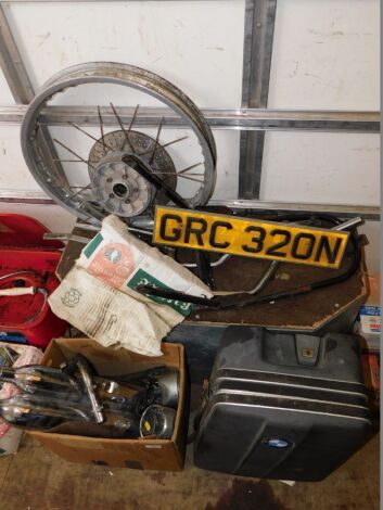 A group of automobilia parts, exhaust pipes, wheel, BMW case, speed gauges, etc. (a quantity)