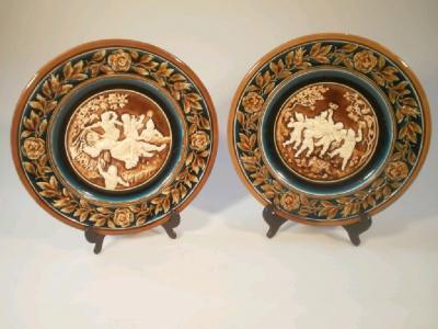 A pair of early 20thC Austrian pottery wall plates