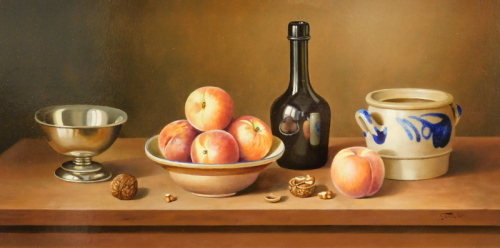 •Andras Gombar (b.1946). Still life, fruit, bottle, walnuts and jar on a table, oil on panel, signed, 30cm x 62cm.