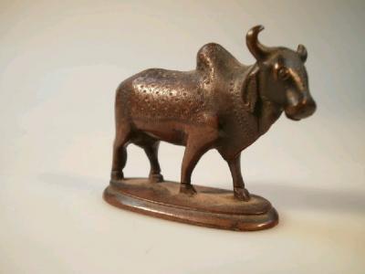 A small cast bronze figure of a sacred Indian cow