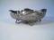 An Elkington & Co Victorian silver plated dish of ovoid form on shell scrolled feet