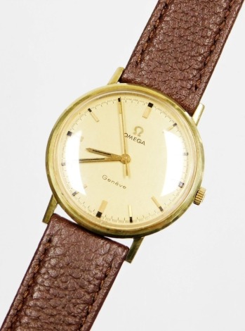 An Omega Geneve gentleman's wristwatch, with a circular dial in a gold plated and stainless steel case, circa 1969, on a later leather strap, the dial 3cm wide.