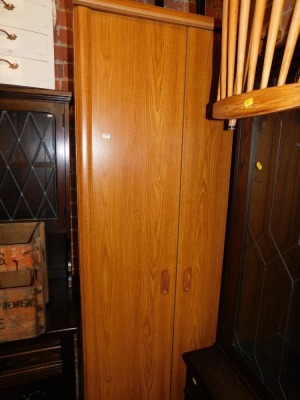 A teak effect wardrobe.