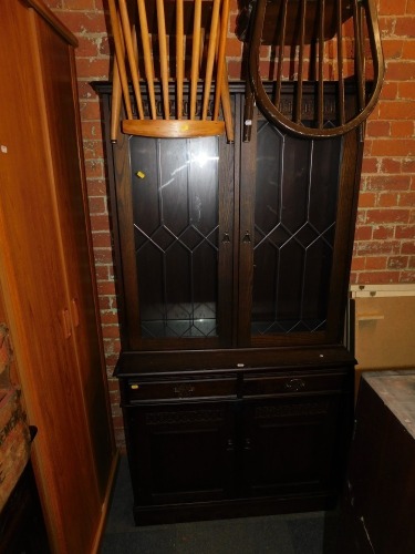 An oak effect display cabinet.